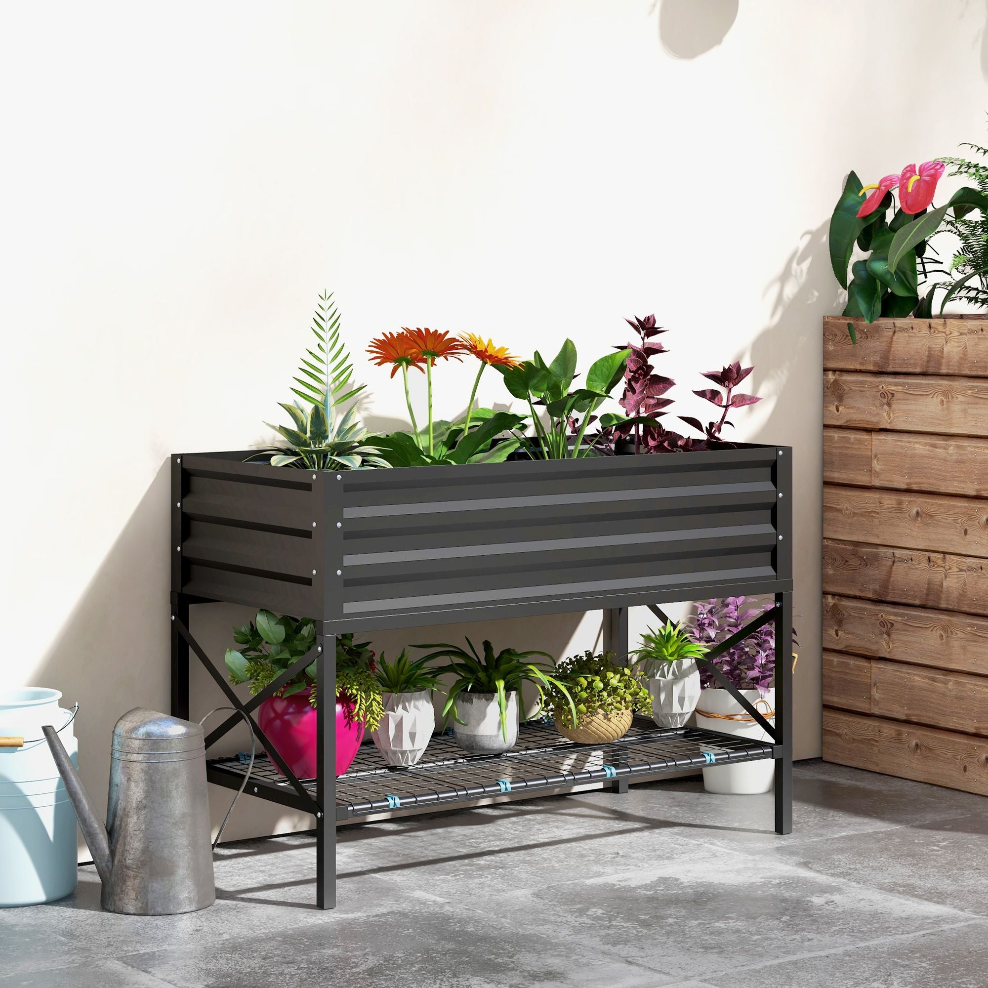 Black Galvanized Raised Garden Bed On Patio With Different Flowers & Pots