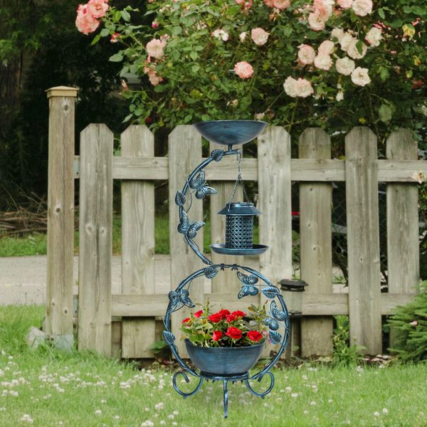 Bird Bath with Solar Bird Feeder and Planter Pedestal In  Garden With Red Flowers
