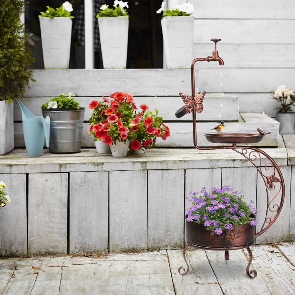 Vintage Bronze Bird Bath with Solar Light and Planter Garden Setting with Purple Flowers