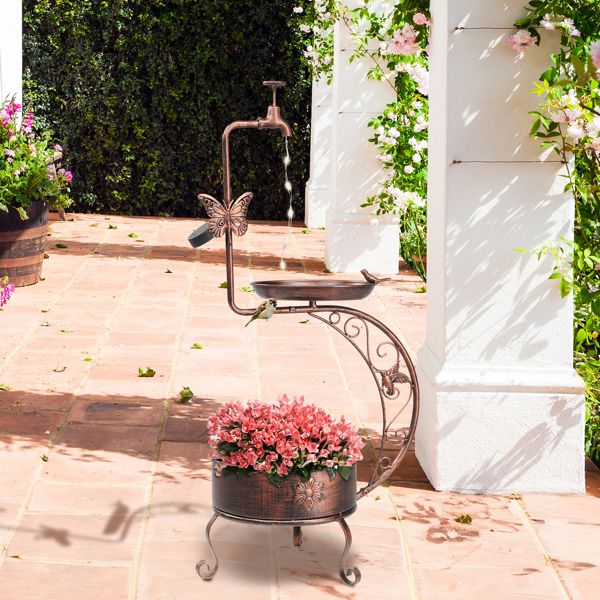 Vintage Bronze Bird Bath with Solar Light and Planter On Patio with Pink Flowers