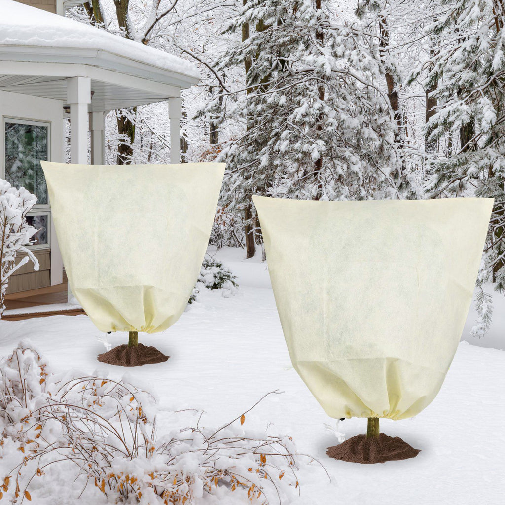 Plant Frost Cover Bags In A Snowy Garden