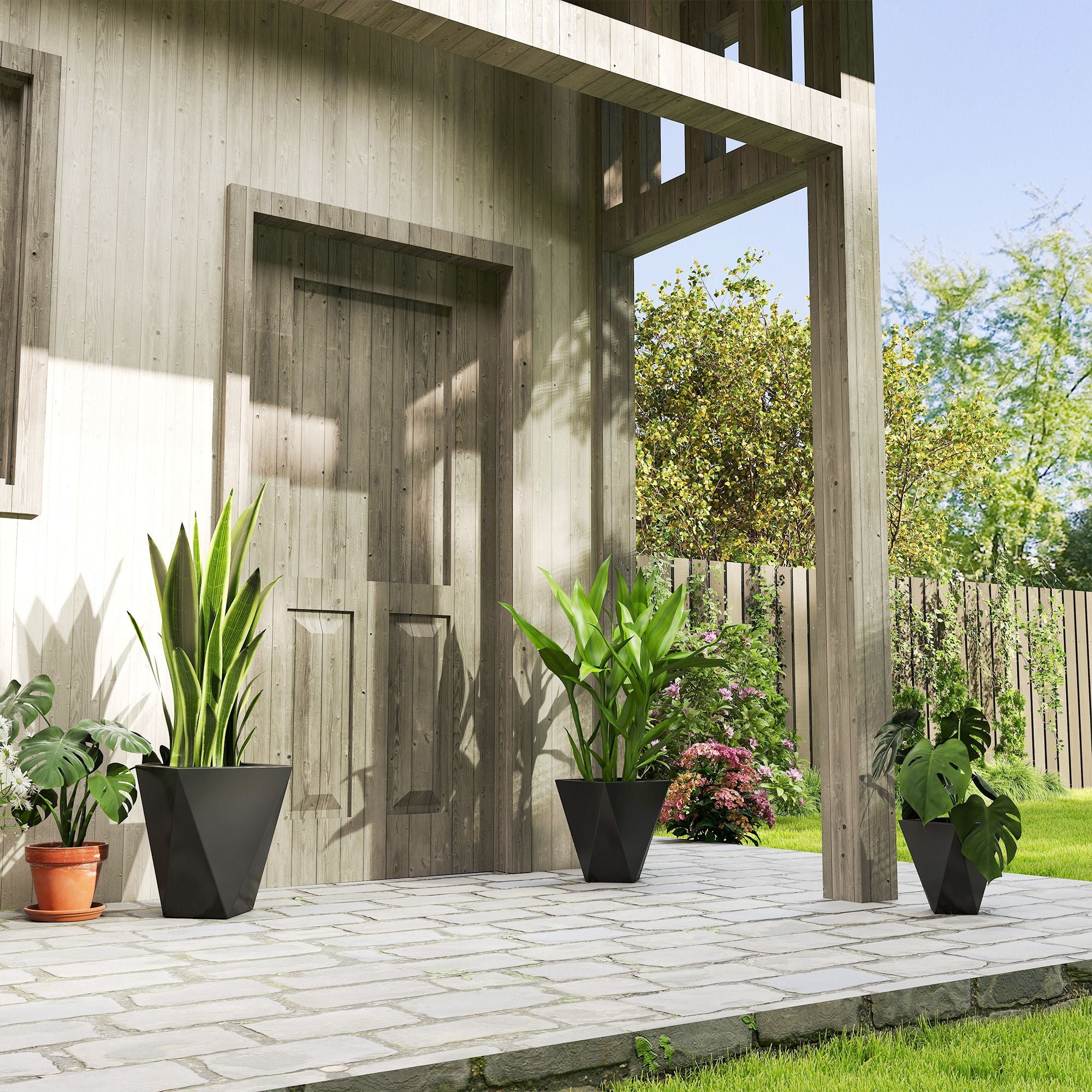 Modern Black Planters On Patio With Plants In